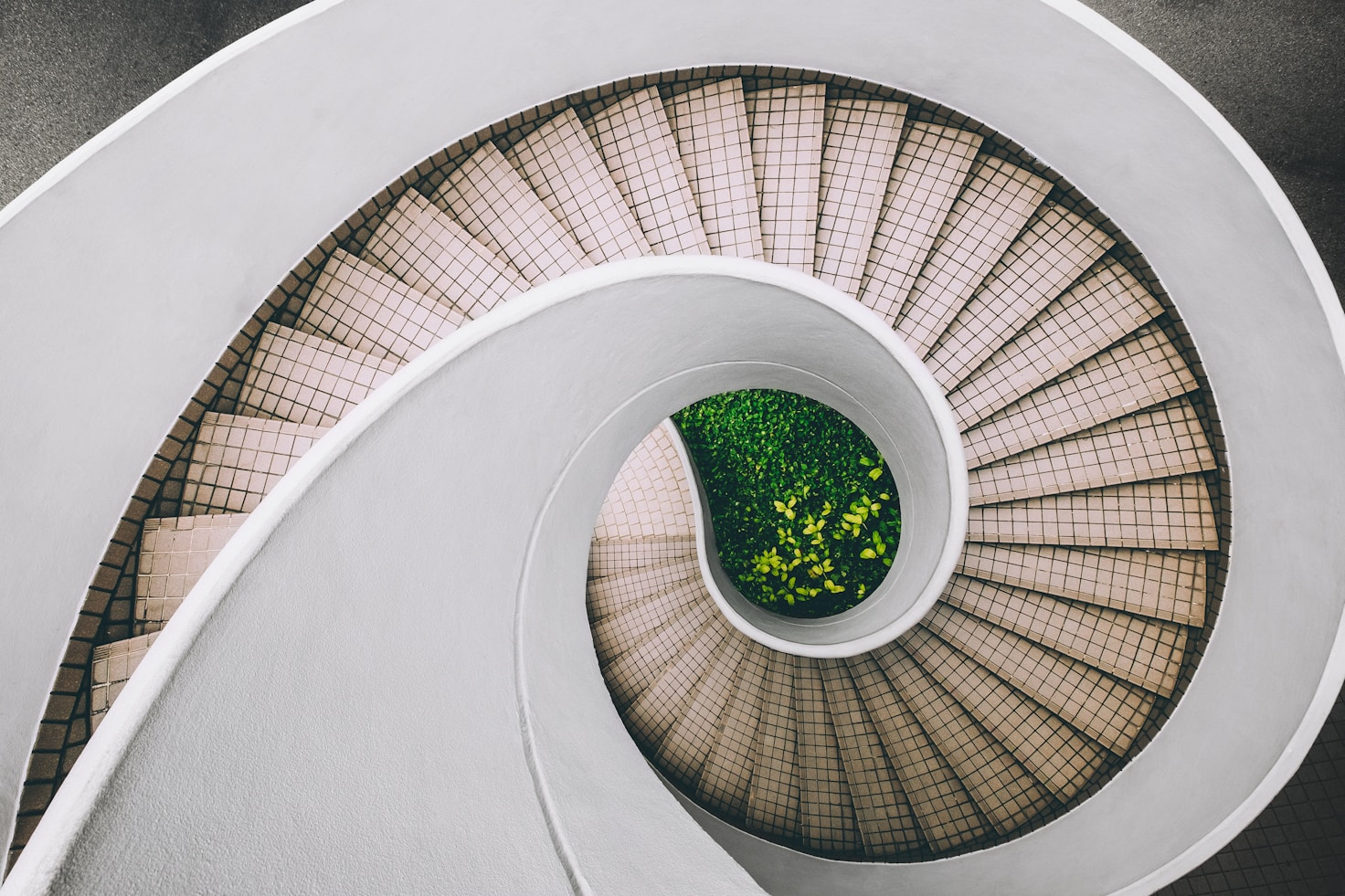 Outdoor spiral staircase photographed from above.